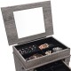 Jewelry cabinet organizer with wooden legs, featuring a mirror and multiple compartments for bracelets, rings, and.