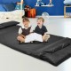 Foldable black PU leather leisure floor sofa bed with two pillows, ideal for reading and relaxing in small spaces.