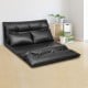 Foldable black PU leather leisure sofa bed with two pillows, adjustable backrest for versatile floor seating.