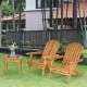 Adirondack chair set with a side table, showcasing solid eucalyptus wood and ergonomic design for outdoor comfort.