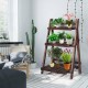Three-tier wooden folding flower stand with potted plants, perfect for indoor or outdoor decoration and storage.