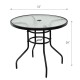 Round 32-inch patio table with tempered glass top and black steel frame, featuring an umbrella hole for outdoor use.