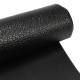 Close-up of a black textured PVC equipment mat, 0.5" thick, designed for home gym use and protecting floors.
