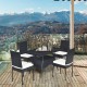 5-piece outdoor patio rattan dining set with glass top and cushions, perfect for family gatherings on the balcony.