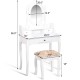 Vanity makeup dressing table with rotating mirror, three drawers, and cushioned stool for elegant beauty routines.