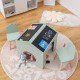 Kids' green wooden table and chair set with chalkboard surface, perfect for playrooms and encouraging creativity.