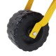 Close-up of the durable molded wheel of a kids' metal wheelbarrow, designed for outdoor play and transporting toys.