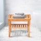 Bamboo shower chair bench with storage shelf, featuring a smooth finish, ideal for bathroom or sauna use.