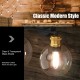 Modern 3-light bubbled glass vanity light with clear glass shades and golden sockets, ideal for elegant bathroom decor.
