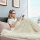 Cozy double-sided throw blanket in beige, featuring shaggy fur and smooth velvet, perfect for snuggling on the sofa.