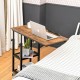 C-shaped adjustable bedside table with a rustic wood top, lockable wheels, and a 2-tier wire shelf for extra storage.