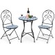 Two folding bistro chairs with blue floral mosaic pattern and a round table, perfect for patio or garden use.