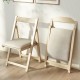 Folding upholstered dining chair with curved backrest in beige, featuring a sturdy rubber wood frame for easy storage.