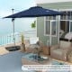 Navy 11 ft outdoor patio umbrella with 360° rotation and adjustable tilt, ideal for sun protection on a balcony.