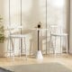 Counter height bar chair set in white with acacia wood frame, featuring a rounded seat and low backrest for comfort.
