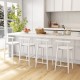 Counter height bar chair set with white acacia wood frame, featuring rounded seats and footrests for comfort in a.