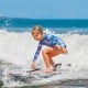 Lightweight boogie board with EPS core and XPE deck, perfect for kids riding waves at the beach.