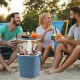 3-in-1 portable cooler bar table in blue with lift top lid, perfect for camping and poolside gatherings.