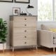 Tall farmhouse chest dresser in grey with five drawers and a sturdy top, perfect for stylish storage in any room.