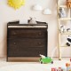 Brown baby changing table with three drawers and safety belt, perfect for diaper changing and storing baby products.
