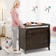 Brown baby changing table with three drawers and safety belt, designed for convenience and stability during diaper.