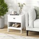 White 2-tier wood nightstand with drawer and open shelf, perfect for versatile storage in bedroom or living room.