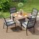 Stackable grey rattan armchairs with removable cushions, perfect for backyard or poolside relaxation.