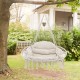 Hand-woven rope hanging chair in beige with thick cushion, featuring elegant tassels for bohemian decor in outdoor.