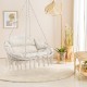 Hand-woven rope hanging chair in beige with thick cushion, featuring elegant tassels for bohemian decor and comfort.