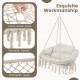 Hand-woven rope hanging chair in beige with thick cushion, featuring romantic tassels and sturdy metal frame for.