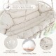 Close-up of the hand-woven rope hanging chair with thick beige cushion, showcasing breathable poly-cotton fabric for.