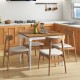 Extendable dining table with rubber wood legs, accommodating 4-8 people, featuring oak veneer and elegant design for.