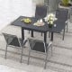 Outdoor dining table set featuring an extendable aluminum table and 4 stackable chairs, perfect for backyard meals.