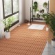 Brown 12 x 12 inch interlocking deck tiles on a floor, showcasing a slatted design for outdoor patio use.