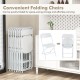 Stacked metal folding chairs with white plastic seats, ideal for home and events, featuring a quick folding design for.