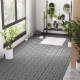 Gray interlocking deck tiles arranged on a floor, showcasing their textured surface and elegant design for outdoor use.