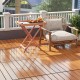 Interlocking deck tiles in brown, showcasing a weather-resistant, anti-slip surface on a stylish patio setting.