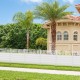 White air conditioner fence panels with metal ground stakes, ideal for outdoor use in gardens or around pools.
