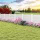 Vinyl picket fence panels in white with flowers and grass, ideal for gardens and patios, featuring durable metal stakes.