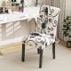 Tufted dining chair with blue and white linen fabric, curved backrest, and sturdy wood legs for stylish comfort.