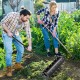Manual lawn aerator with galvanized steel spikes, 21 inches tall, ideal for loosening soil and promoting plant growth.