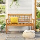 Acacia wood patio bench with curved armrests, slatted seat, and backrest, perfect for backyard or garden seating.