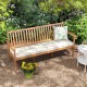 Outdoor 3-seat wood bench in acacia with white cushion, ideal for garden or backyard relaxation.