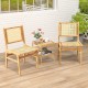 Rattan dining chairs with natural cane backrest and teak wood frame, perfect for stylish indoor or outdoor settings.
