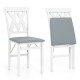 Folding wooden dining chair set of 2 with white frames and gray faux leather upholstery, ideal for small spaces.