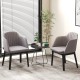 Curved backrest grey upholstered velvet dining chairs set of 2 with solid rubber wood frame for versatile seating.