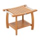 Teak wood shower bench with curved seat, stainless steel handles, and double-layer shelf for versatile storage and use.