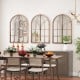 Arched window pane mirrors in a rustic wooden frame, beautifully arranged for a charming living room setting.