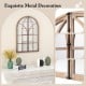 Arched window pane mirror with rustic wooden frame and metal decoration, perfect for living room or entryway decor.