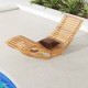 Acacia wood patio rocking sun lounger with ergonomic curved seat, perfect for poolside relaxation.